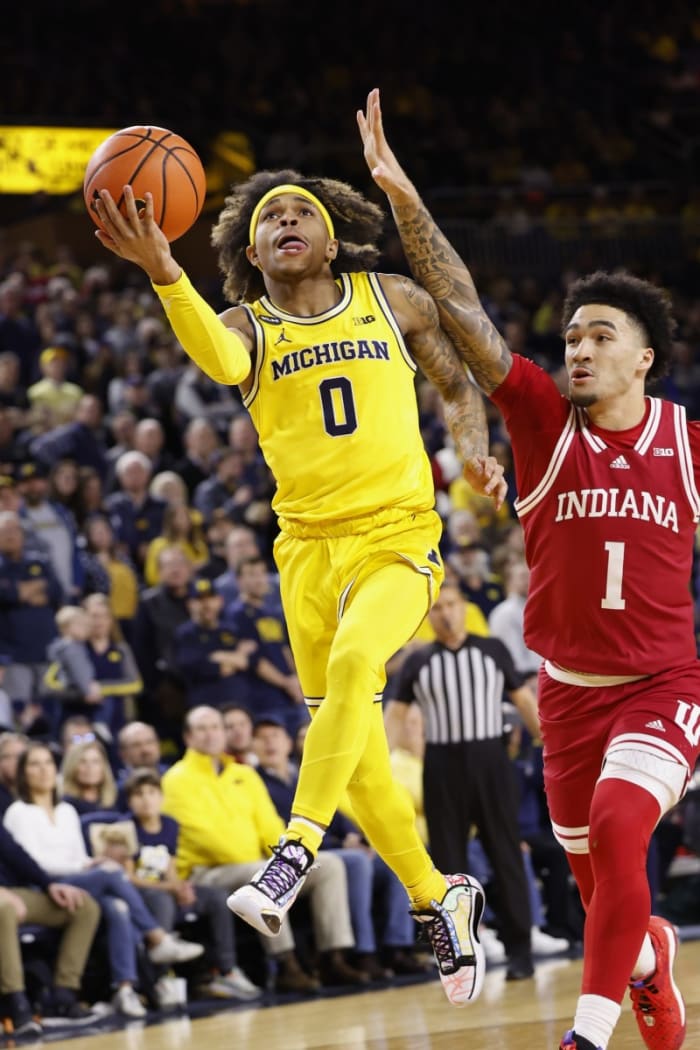 Michigan Wolverines guard Dug McDaniel (0) shoots on Indiana Hoosiers guard Jalen Hood-Schifino (1) in the first half at Crisler Center.